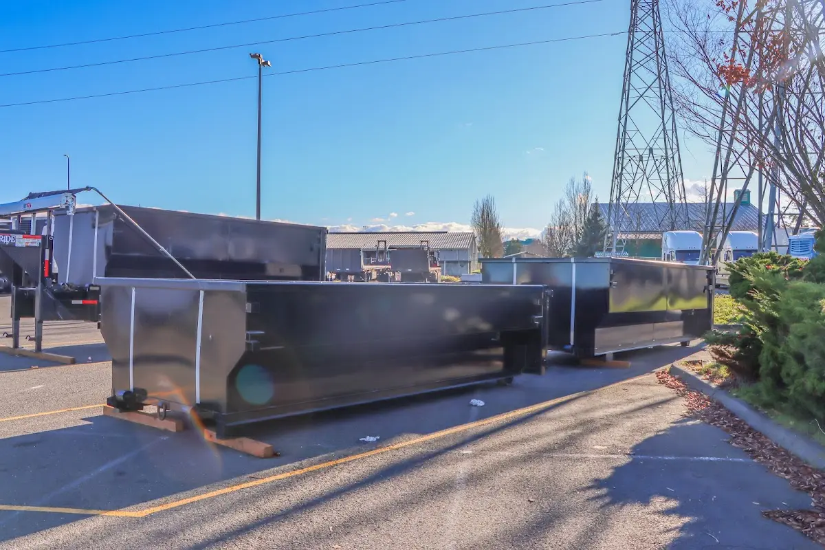 Roll-off dumpster ready for waste disposal at job site for Concrete Dumpster Rental in Camp Swift